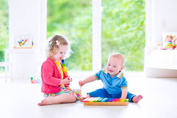 istock Beautiful kids playing music with xylophone 501173937