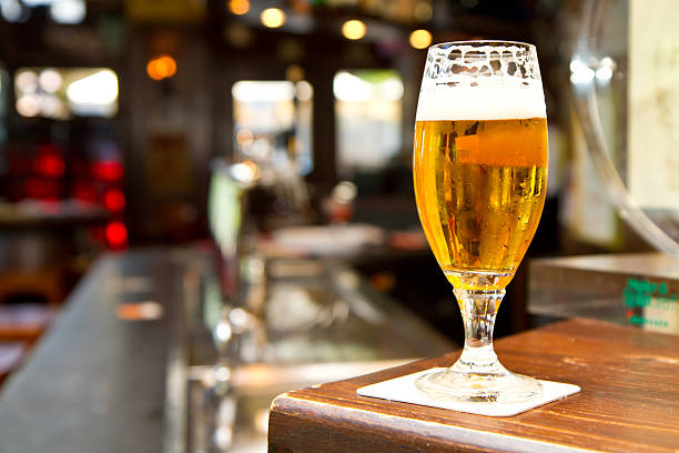 istock Glass of light beer on a pub 501175871