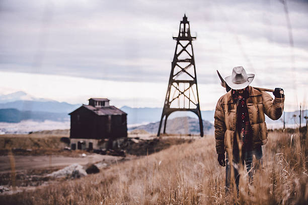 istock High contrast image of rugged man walking through western plain 501191251