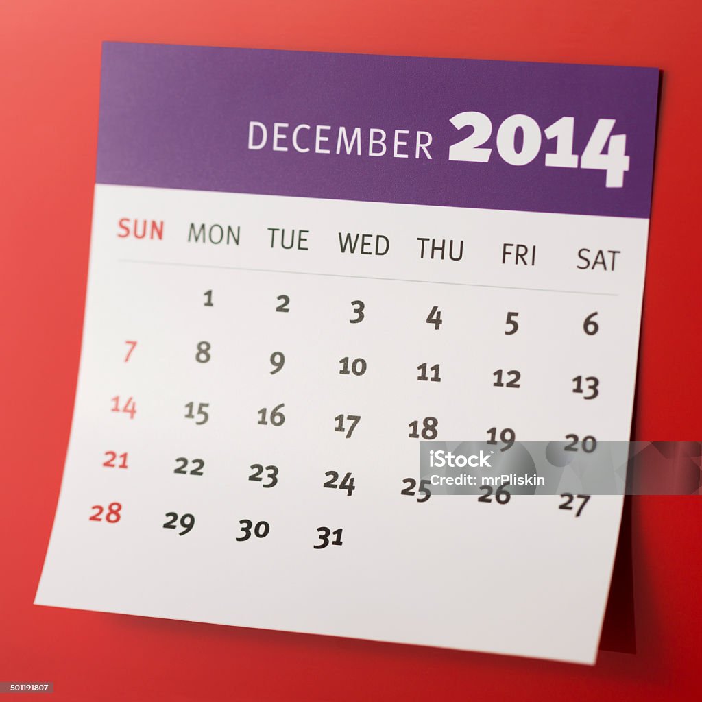 Diciembre de 2014, el calendario sobre un fondo rojo - Foto de stock de 2014 libre de derechos