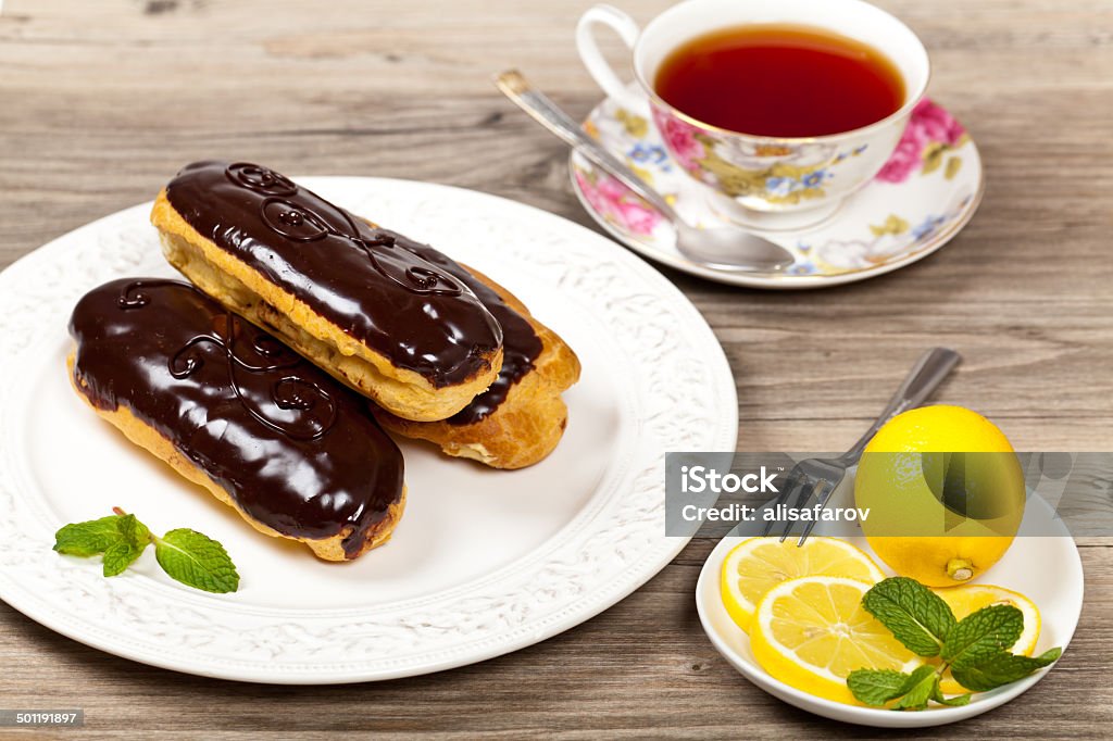 Chocolate eclairs Homemade eclairs with cream Baked Stock Photo