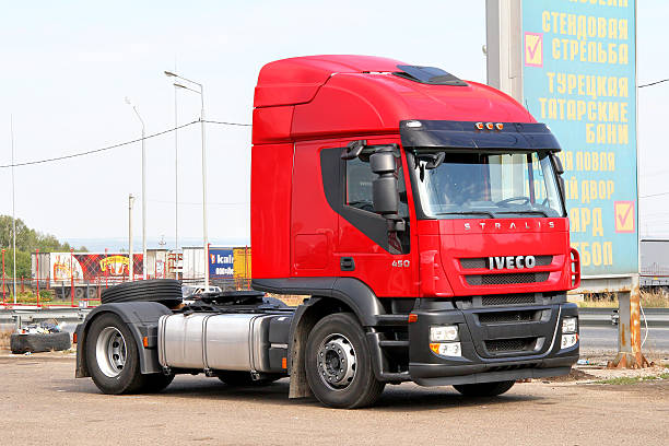 Iveco Stralis AT450 Tatarstan, Russia - August 21, 2011: Modern red semi-trailer truck Iveco Stralis AT450 is parked at the interurban freeway. park designer label stock pictures, royalty-free photos & images