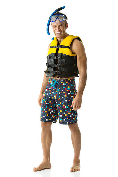 istock Happy young man standing with life jacket 501192121