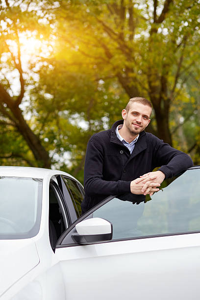 istock Man leaning on car door 501193428