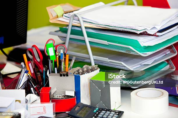 Closeup Of Real Life Messy Desk In Office Stock Photo - Download Image Now - Desk, Desktop PC, Business