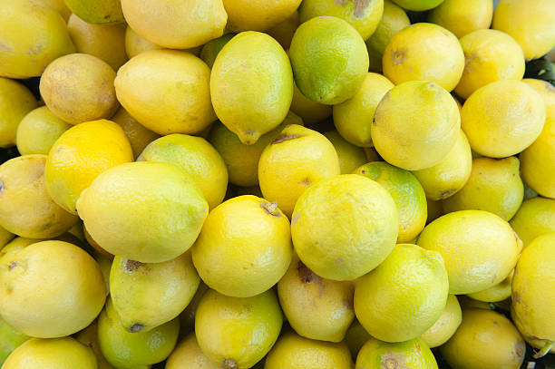 istock Yellow background of lemon heap 501194898