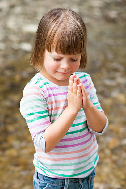 istock little girl praying 501196108
