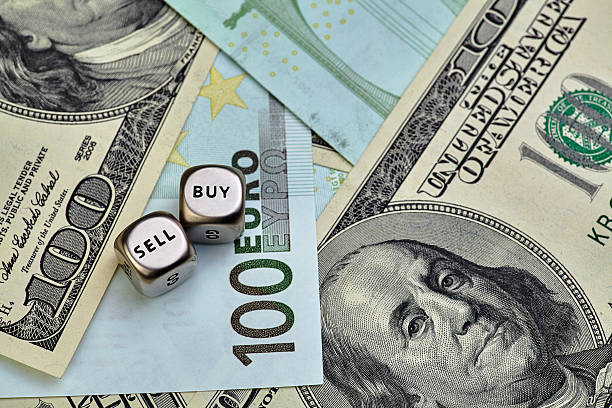 istock EURO, USD banknotes and dices cubes 501197132