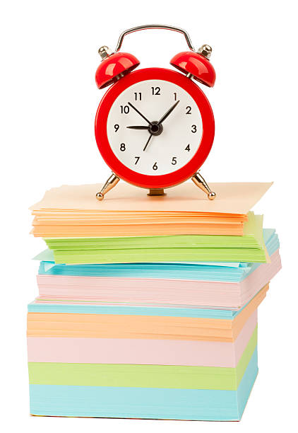 istock Alarm clock on pile of stickers 501197546
