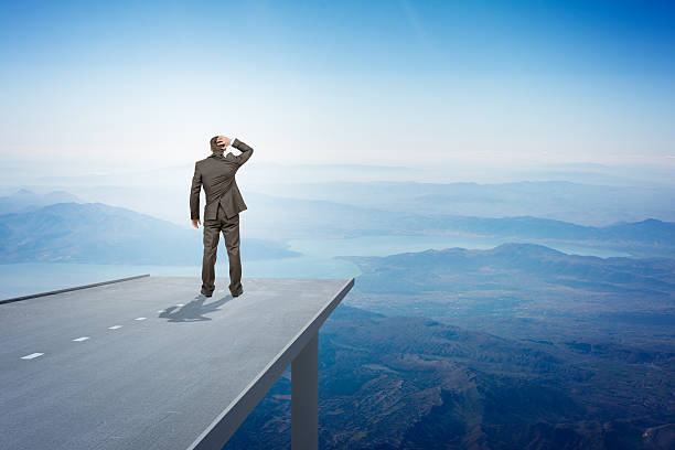istock Businessman on road in sky, rear view 501197768