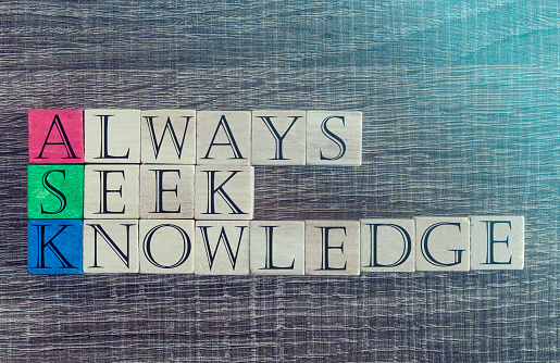 Knowledge concept with quote written on wooden blocks. Cross processed image