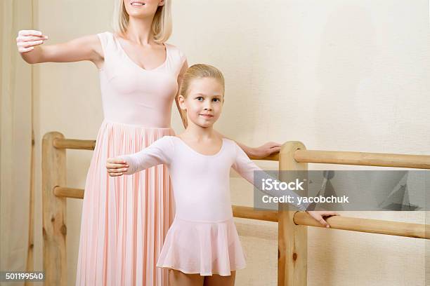 Ballet Teacher And Her Apprentice Are Holding A Pose Stock Photo - Download Image Now