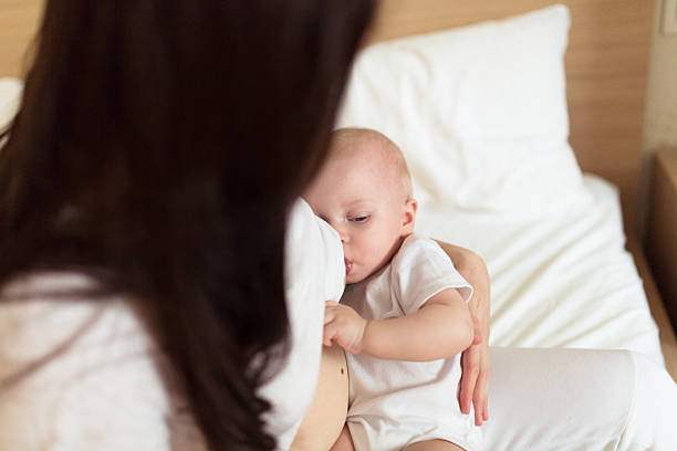 istock Baby with her mother , light,   breastfeeding 501201654