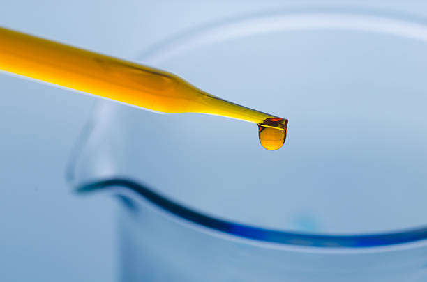 istock science laboratory pipette with drop on test tube background , l 501202042