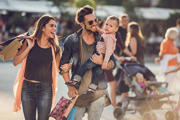 istock Young happy parents having fun with their son in shopping. 501202124
