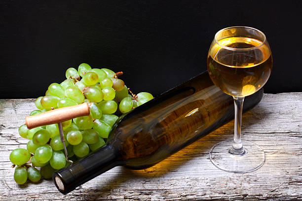 istock wine bottle, grapes and a glass of wine 501202238