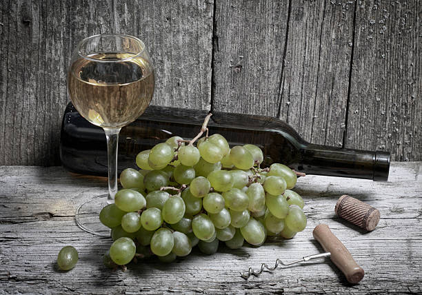 istock wine bottle, grapes and a glass of wine 501202406