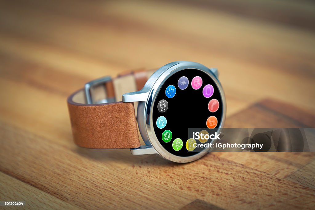 Steel Smartwatch with Apps on Screen Smart watch (smartwatch) with mobile apps on screen. There are applications to connect with friends using social media, send text messages and emails. There are also applications for making telephone calls, track your daily steps, calories and distance traveled, navigation using GPS, browse the internet and take photos. Smart Watch Stock Photo