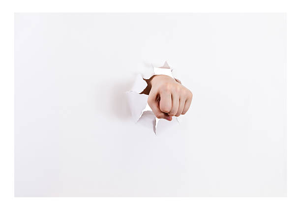 istock front view of the fist breaks a paper isolated 501203904