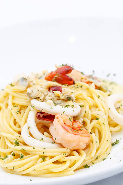 istock Delicious Spaghetti with Seafood on white plate 501205251