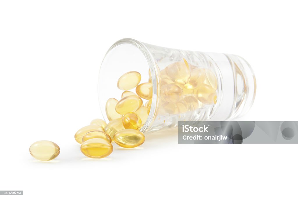 Omega 3 cápsulas de Óleo de peixe e vidro. - Foto de stock de Alimentação Saudável royalty-free