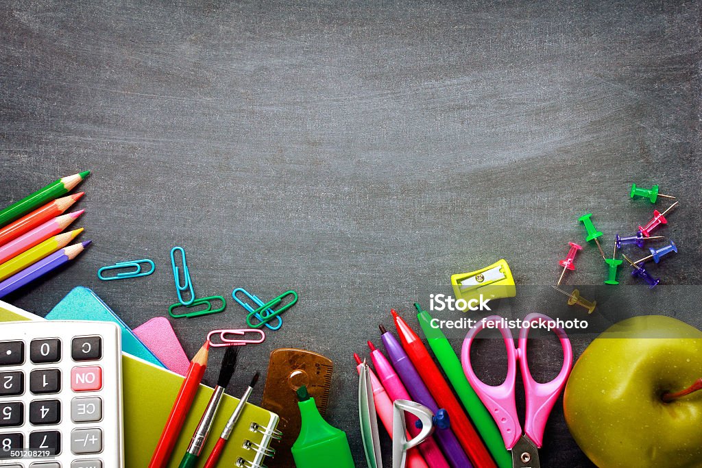 School supplies on blackboard background School supplies on blackboard background ready for your design Back to School Stock Photo