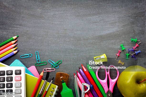 School Supplies On Blackboard Background Stock Photo - Download Image Now - Back to School, Backgrounds, Black Color