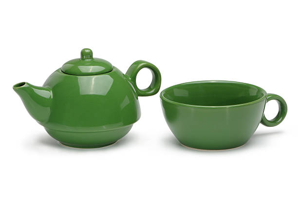 istock Set of a green ceramic teapot and mug 501209491