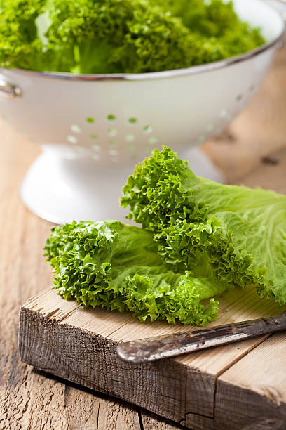 istock fresh lollo leaves on chopping board for salad 501209633