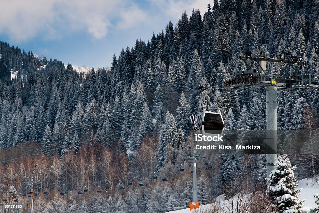 Ski lift Ski lift at the snow covered mountains background Activity Stock Photo