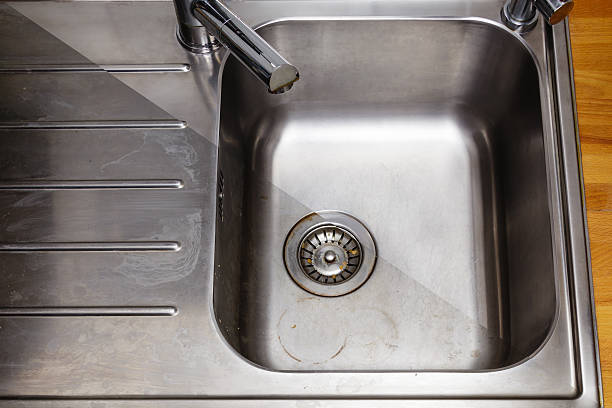istock Dirty and cleaned to shine sink in the kitchen 501219122
