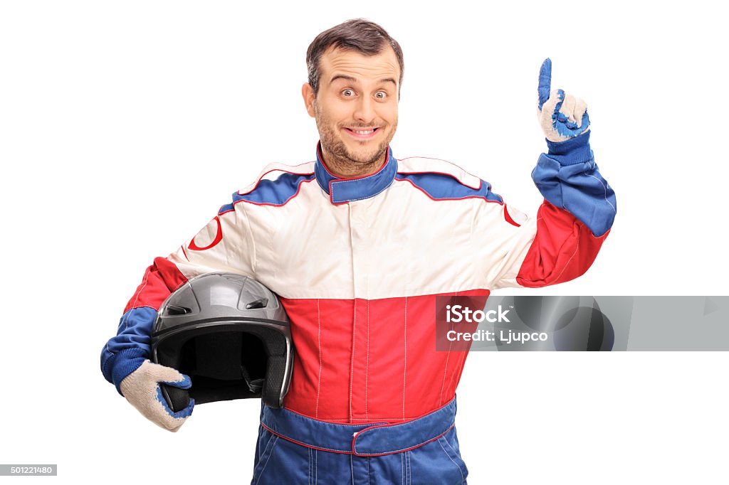 Young male car racer having an idea Young male car racer holding a helmet and having an idea isolated on white background Race Car Driver Stock Photo