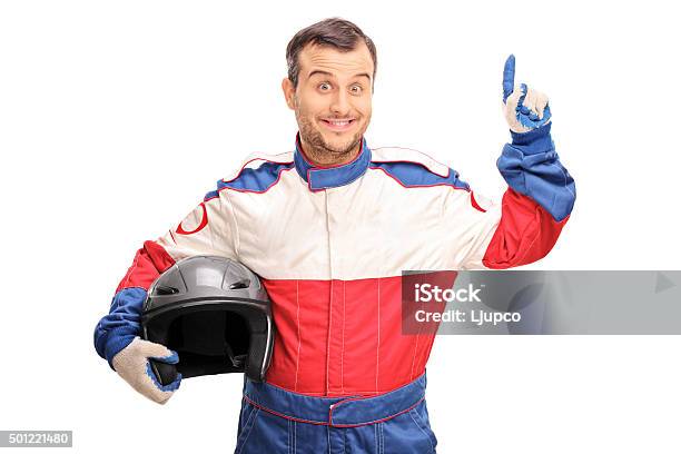 Young Male Car Racer Having An Idea Stock Photo - Download Image Now - Race Car Driver, Males, 20-29 Years