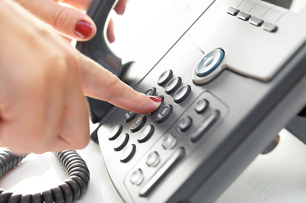 istock Female finger dialing telephone  number 501221566