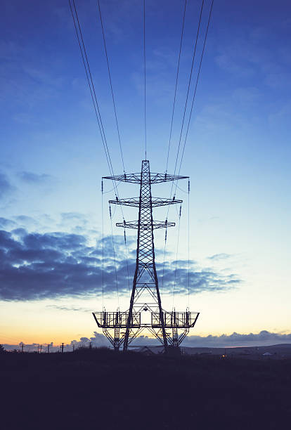 istock Electricity Pylon at sunset - UK 501223082