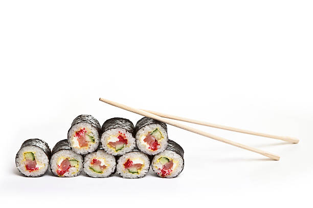 istock sushi with chopsticks on a white background 501227658