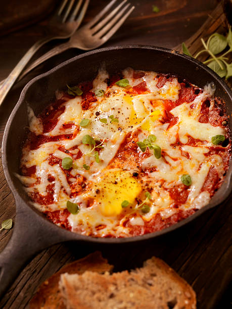 istock Eggs Baked in Spice Tomato Sauce with Mozzarella Cheese 501230374