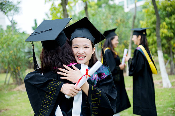 istock Graduates hugging outdoors 501232614
