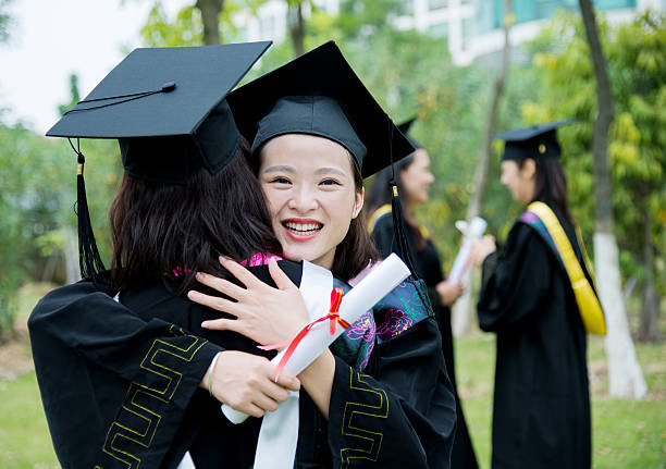 istock Graduates hugging outdoors 501232786