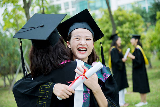 istock Graduates hugging outdoors 501232974