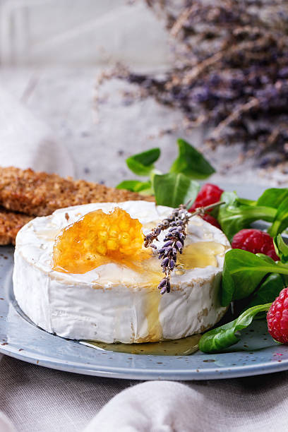 istock Goat cheese with honey and raspberries 501234436