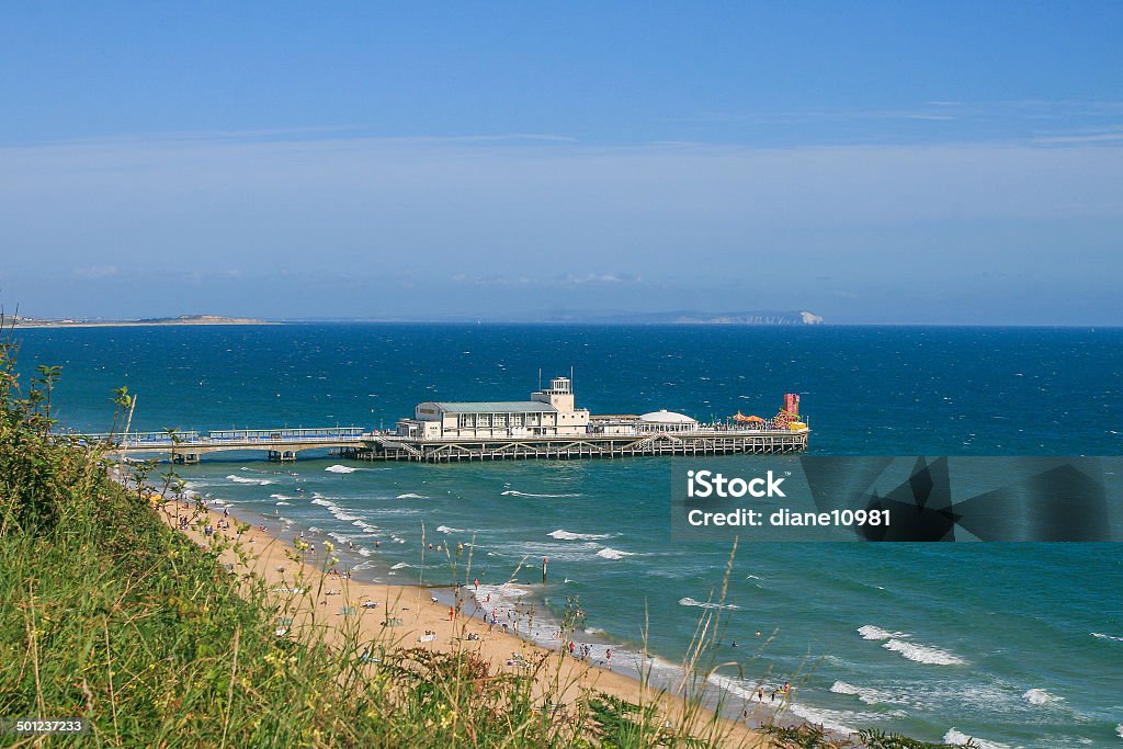 Bournemouth Pier View of Bournemouth Pier from West Cliff, looking towards Boscombe, the Isle of Wight and Hengistbury Head, Dorset. Beach Stock Photo