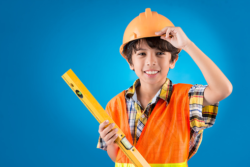 Boy pretending to be a construction worker
