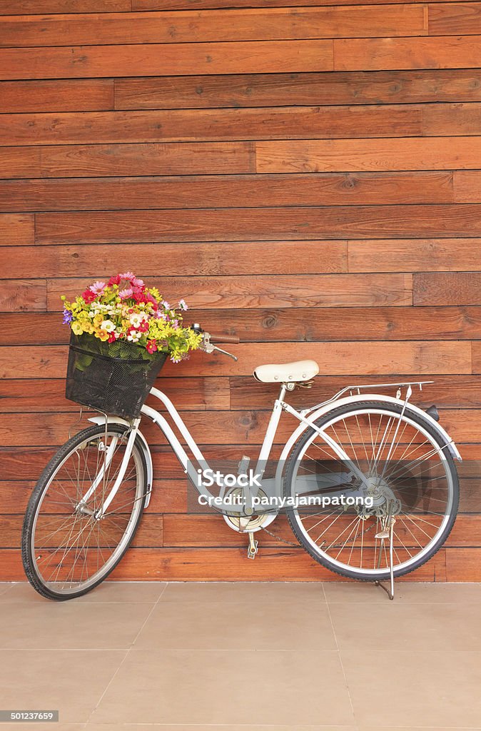 Old bicycle and flowers Basket Stock Photo