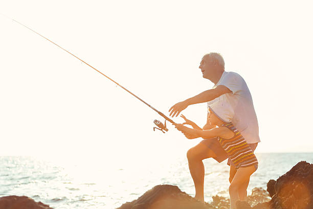 istock Father and Son Fishing Together. 501237771
