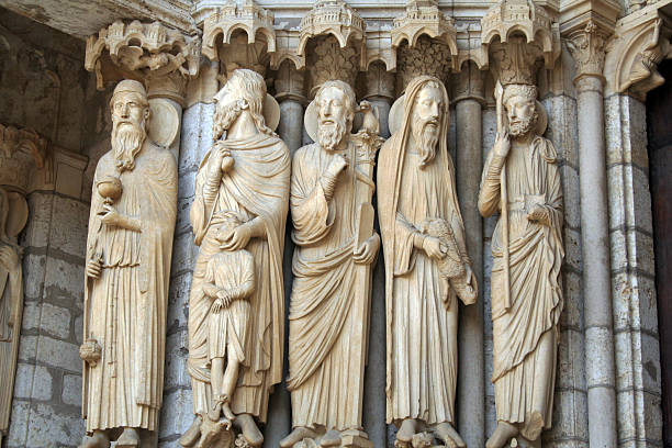 France: Chartres Cathedral Statue Chartres, France - July 29, 2006: Statues at the Chartres Cathedral, constructed between 1194 and 1250, and is now a UNESCO World Heritage Site and one of France's biggest tourist attractions. It is noted for its spectacular stained glass windows. chartres cathedral stock pictures, royalty-free photos & images