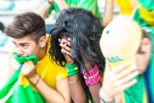 Sad Brazilian Supporters at Stadium stock photo