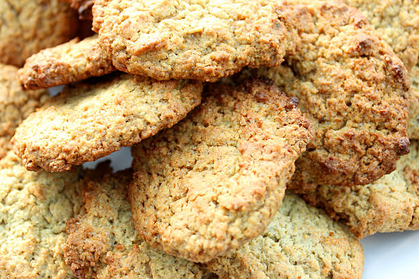 istock Image of freshly baked cookies / oat biscuits on white plate 501242723