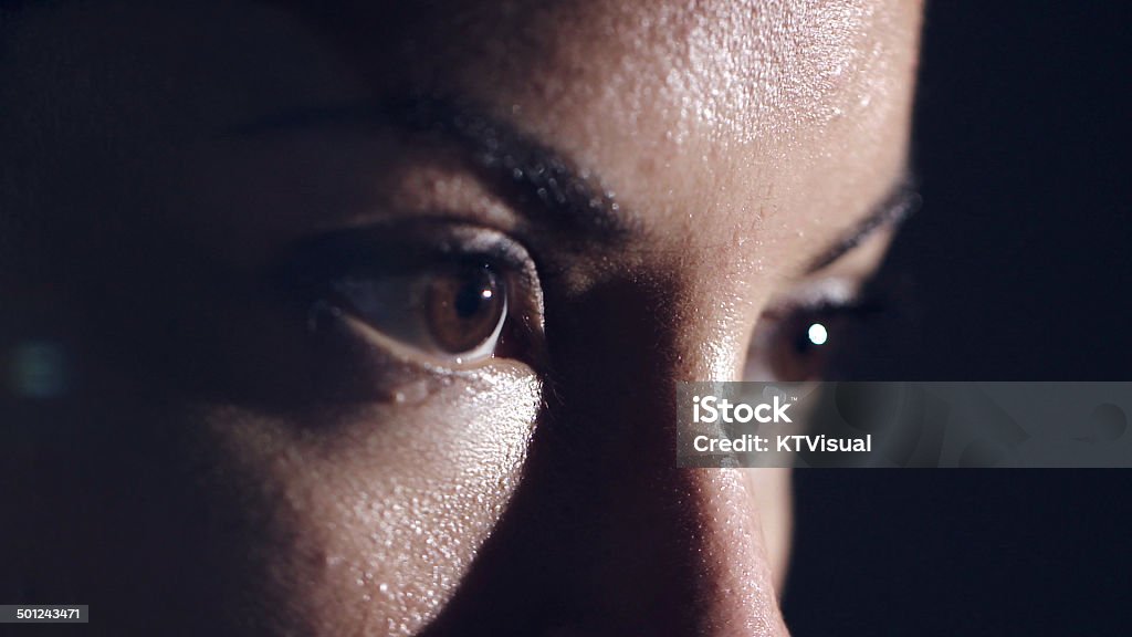 Female Athlete's Eyes An extreme close up of a female athletes brown eyes, heavily focused on her mission. Sport Stock Photo