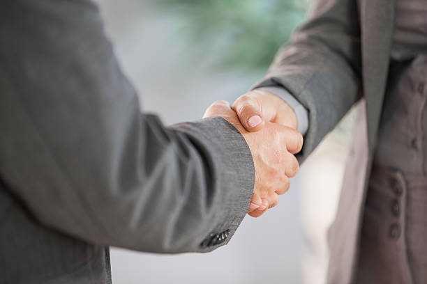 istock Business people shaking hands close up 501243625